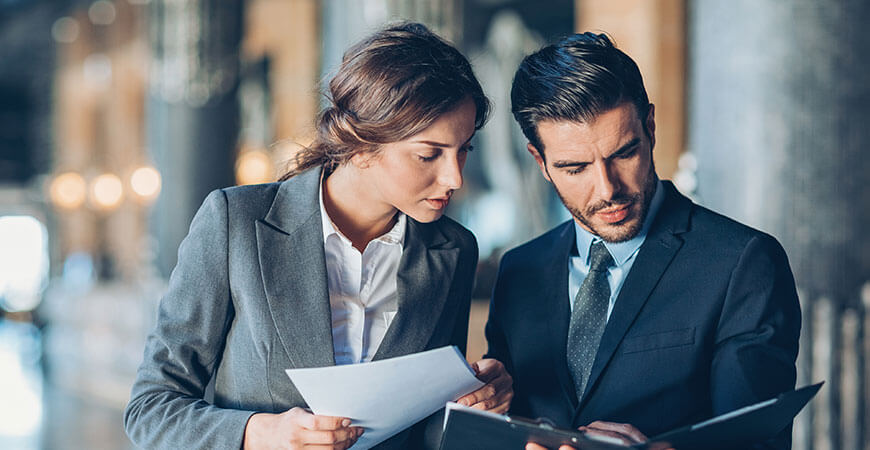 Male and female lawyers presenting a Binding Financial Agreement for clients in Australia – Adams United Lawyers