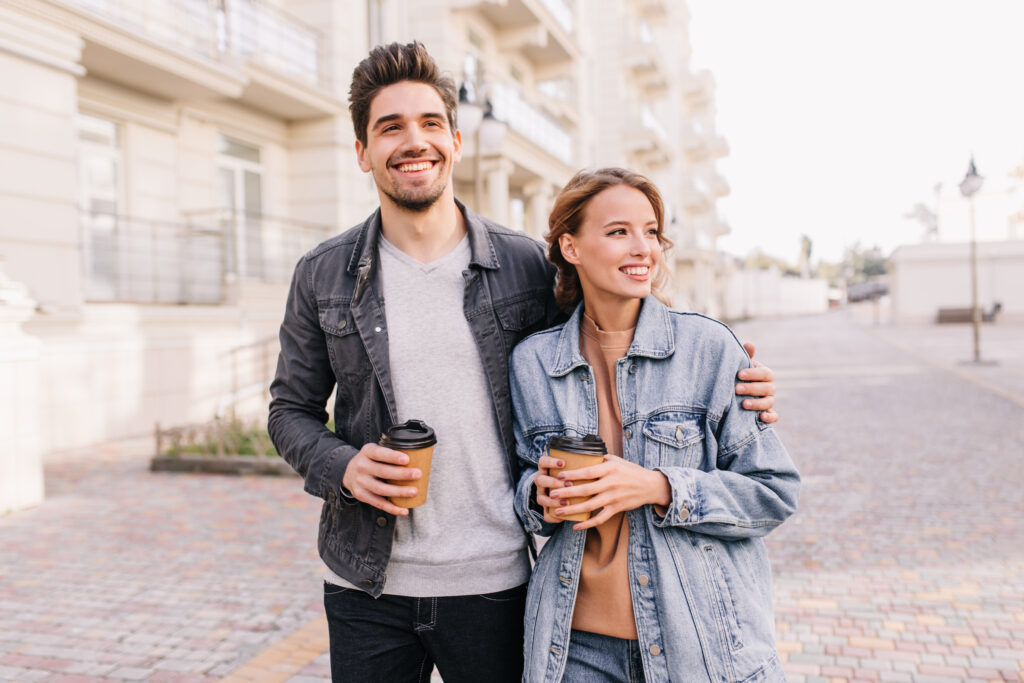 Young Australian couple standing together while moving in, symbolising relationship milestones and potential de facto status under Australian Family Law